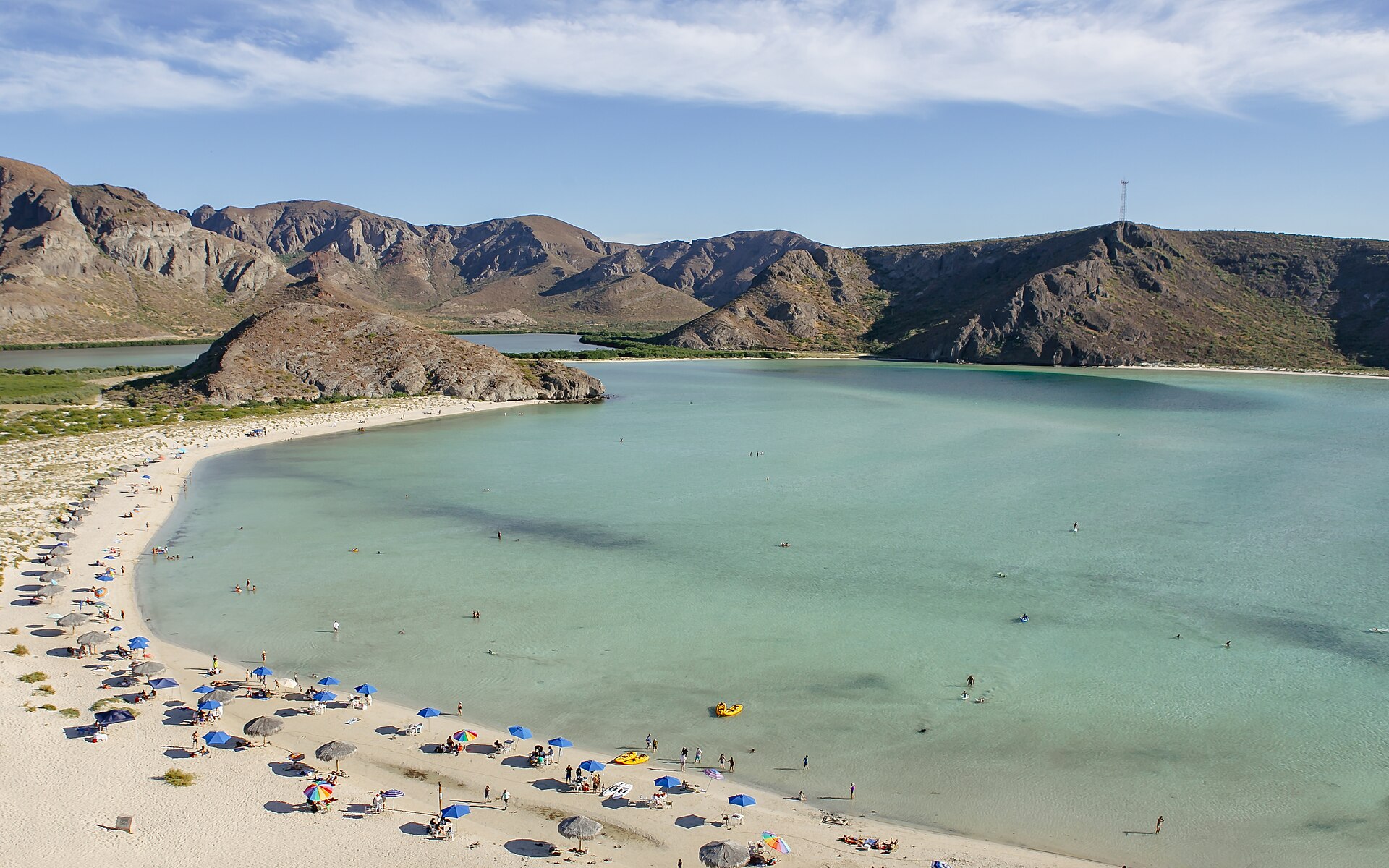 Shallow turquoise water and desert hills at Balandra Beach near La Paz